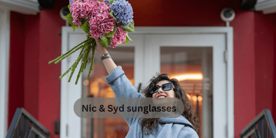 A woman holds a bouquet of flowers, with the phrase "Nic & Syd sunglasses" displayed prominently.